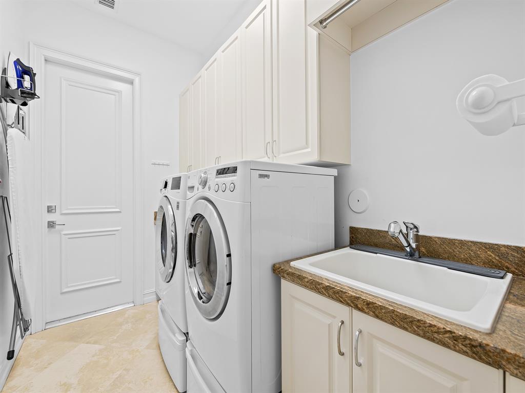731 Coconut Palm Terrace Plantation, FL 33324 - Photo 31 of 48 a utility room with dryer and washer
