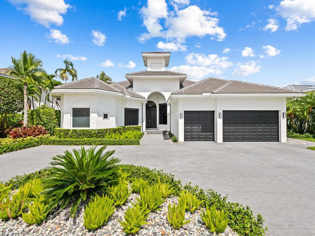 731 Coconut Palm Terrace Plantation, FL 33324 - Photo 33 of 48 a front view of a house with a garden