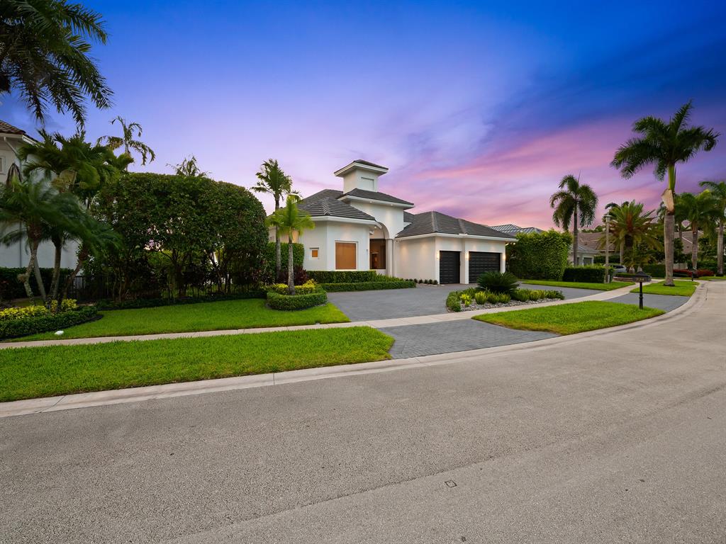 731 Coconut Palm Terrace Plantation, FL 33324 - Photo 40 of 48 a front view of a house with a yard and palm trees