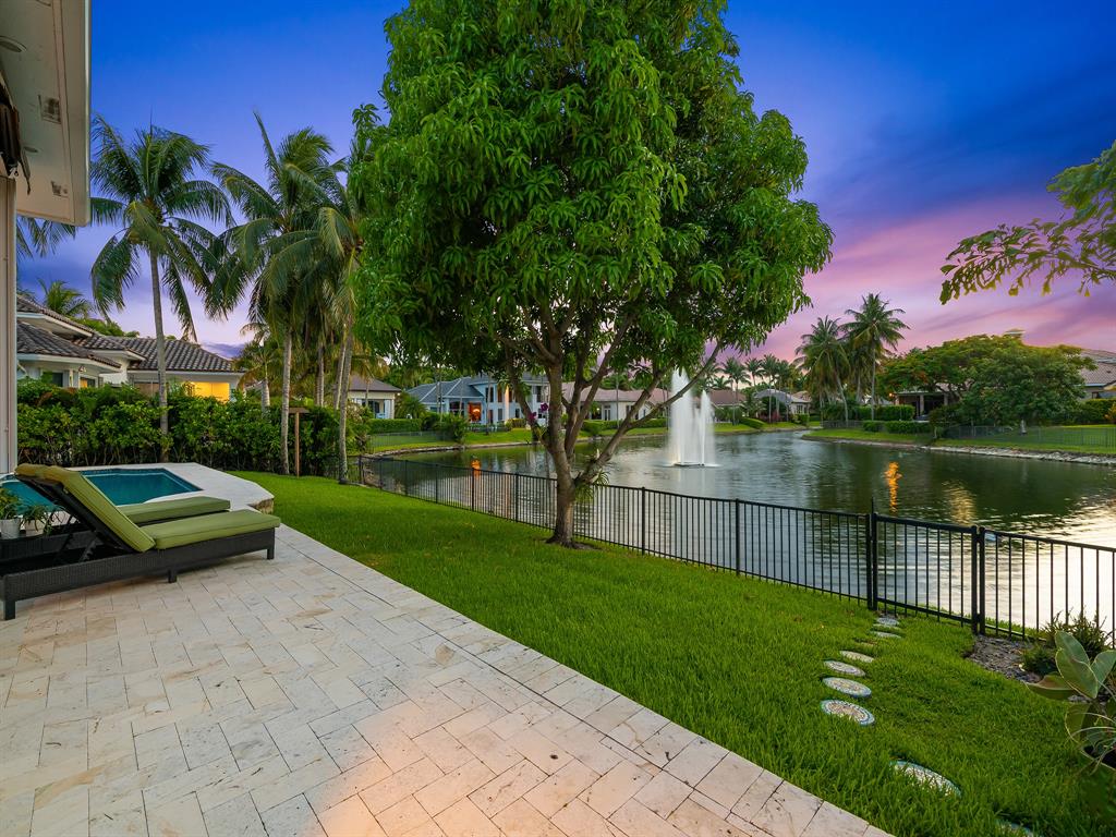 731 Coconut Palm Terrace Plantation, FL 33324 - Photo 42 of 48 a view of a lake with a garden