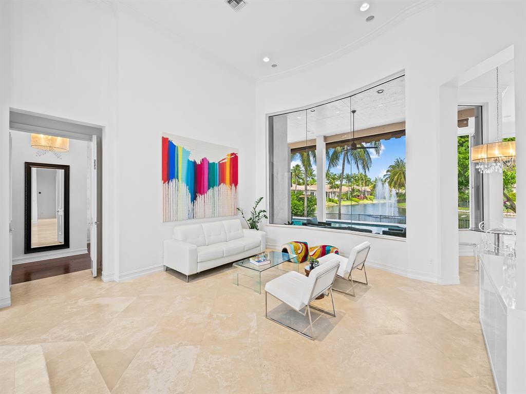 731 Coconut Palm Terrace Plantation, FL 33324 - Photo 7 of 48 a living room with furniture and a flat screen tv