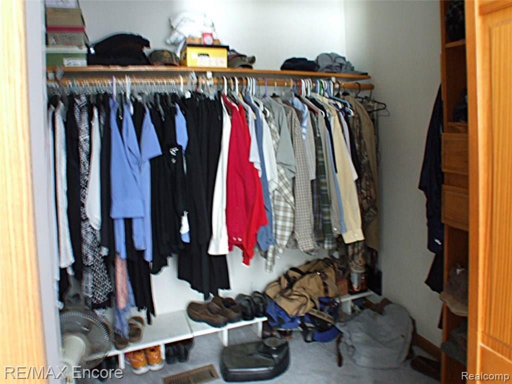 8945 Michigamme Road Clarkston, MI 48348 - Photo 18 of 30 Master walk in closet with built in storage spaces
