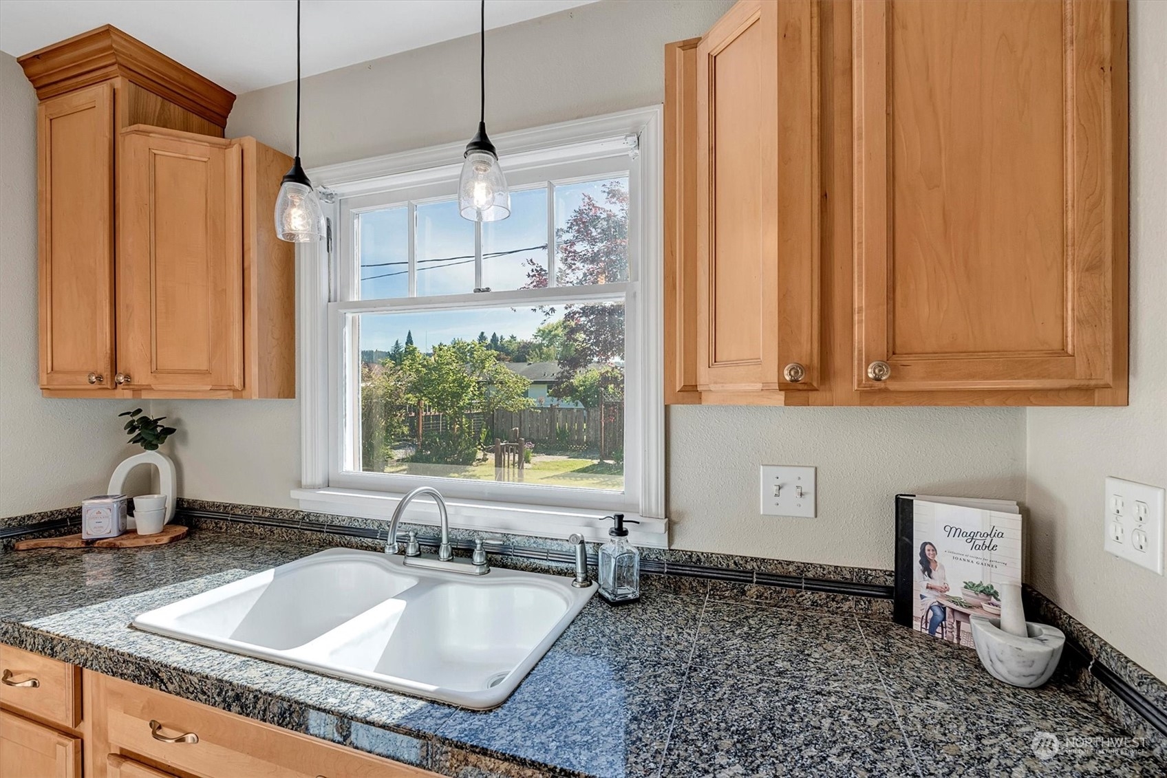 513 Meade Avenue Sumner, WA 98390 - Photo 13 of 35 a kitchen with sink refrigerator and window