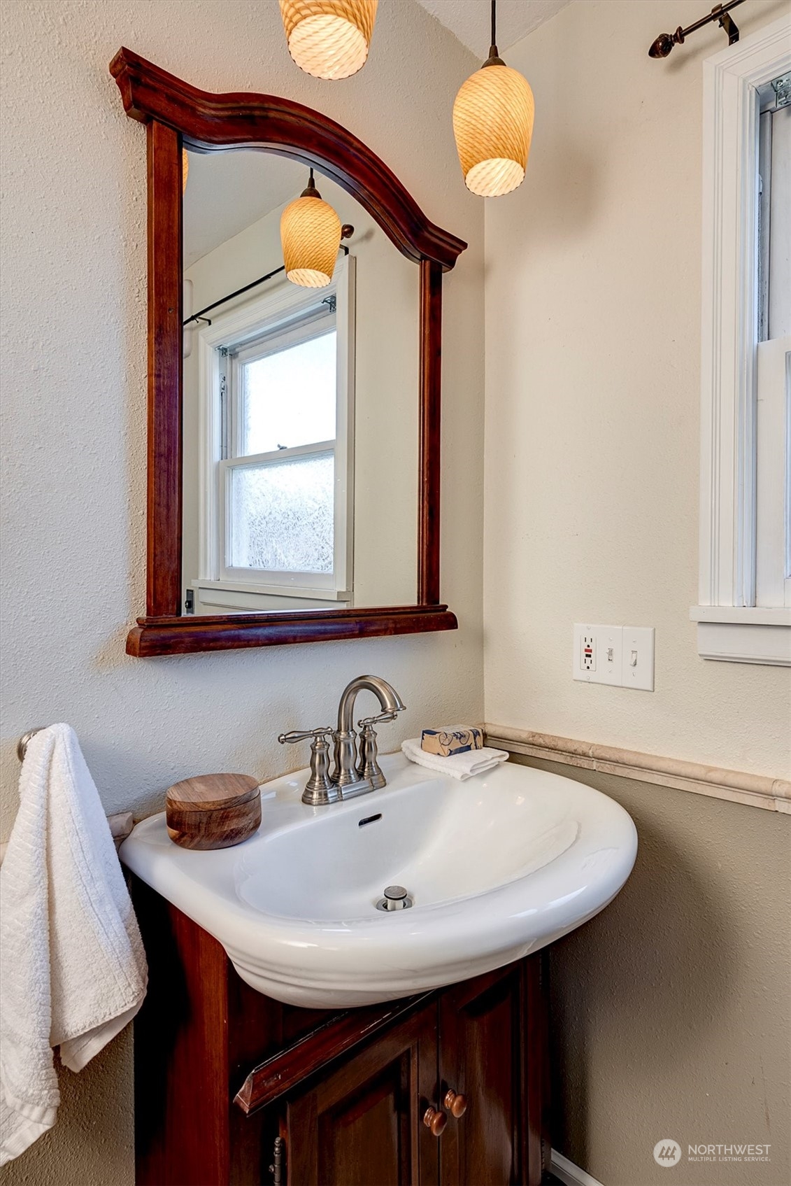 513 Meade Avenue Sumner, WA 98390 - Photo 19 of 35 a bathroom with a sink and a mirror