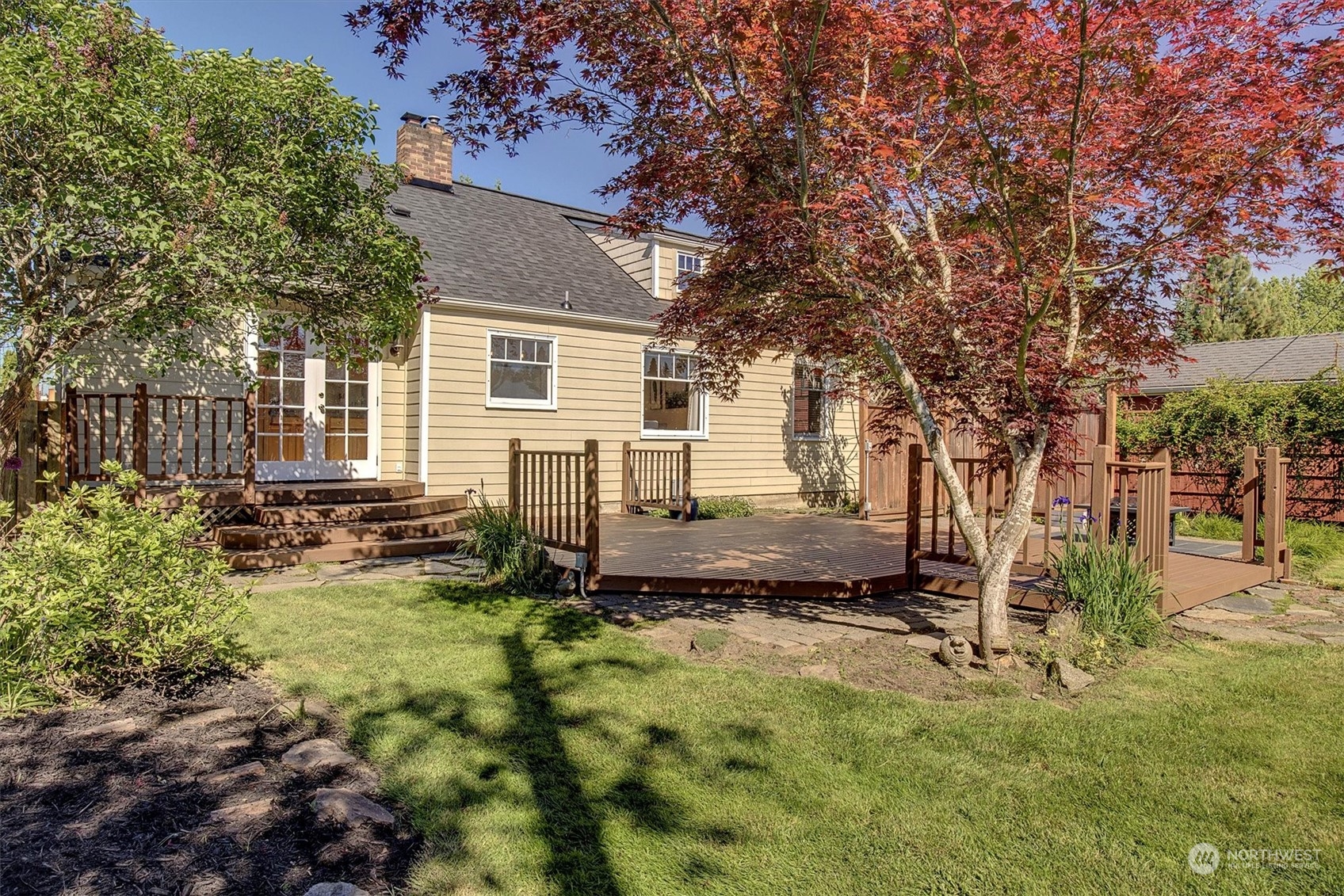 513 Meade Avenue Sumner, WA 98390 - Photo 26 of 35 a backyard of a house with yard and outdoor seating
