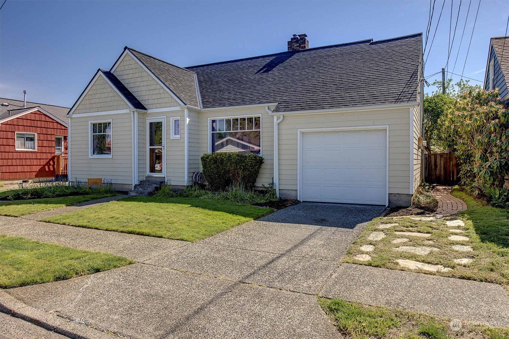 513 Meade Avenue Sumner, WA 98390 - Photo 35 of 35 a front view of a house with a yard and garage