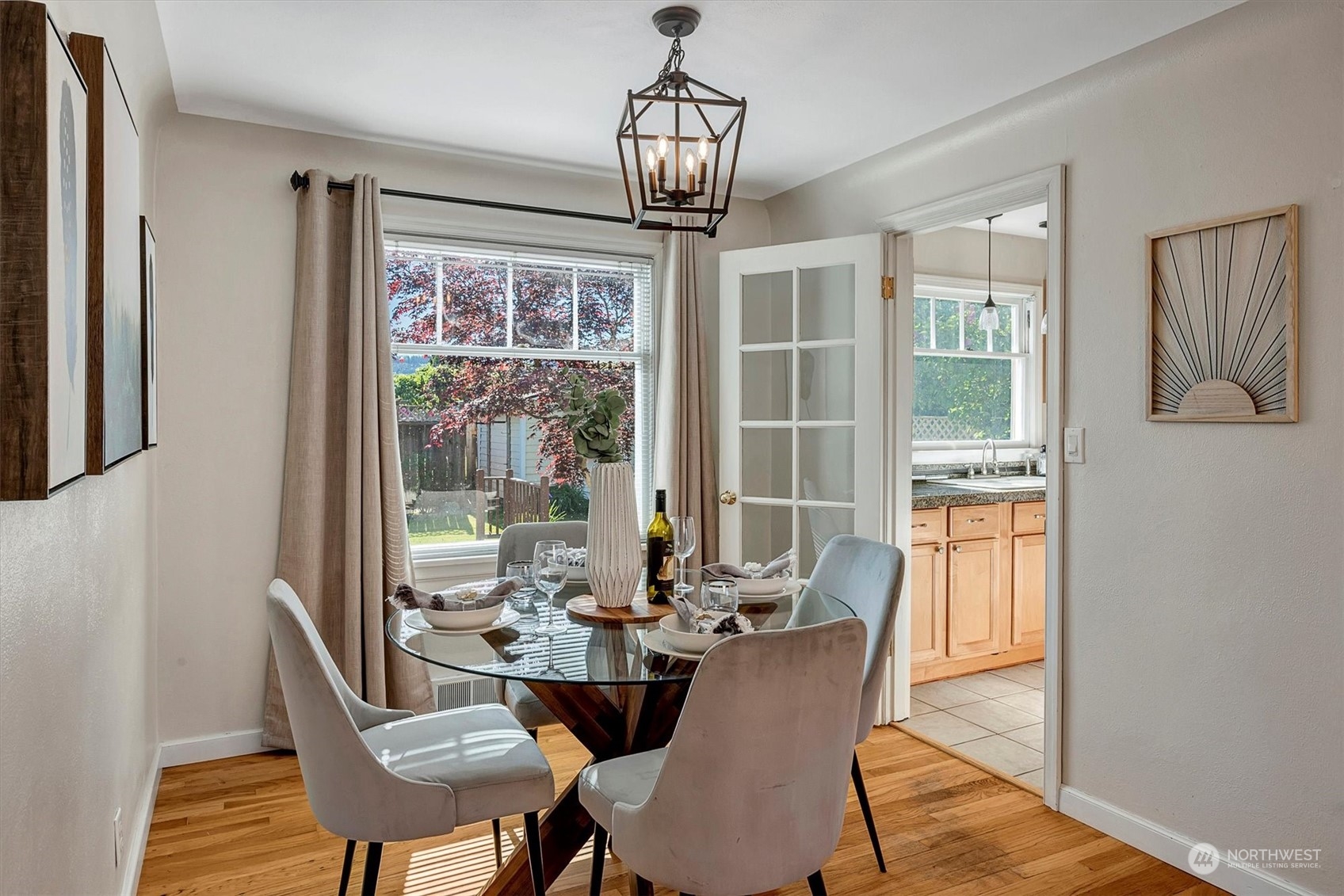 513 Meade Avenue Sumner, WA 98390 - Photo 8 of 35 a view of a dining room with furniture wooden floor and chandelier