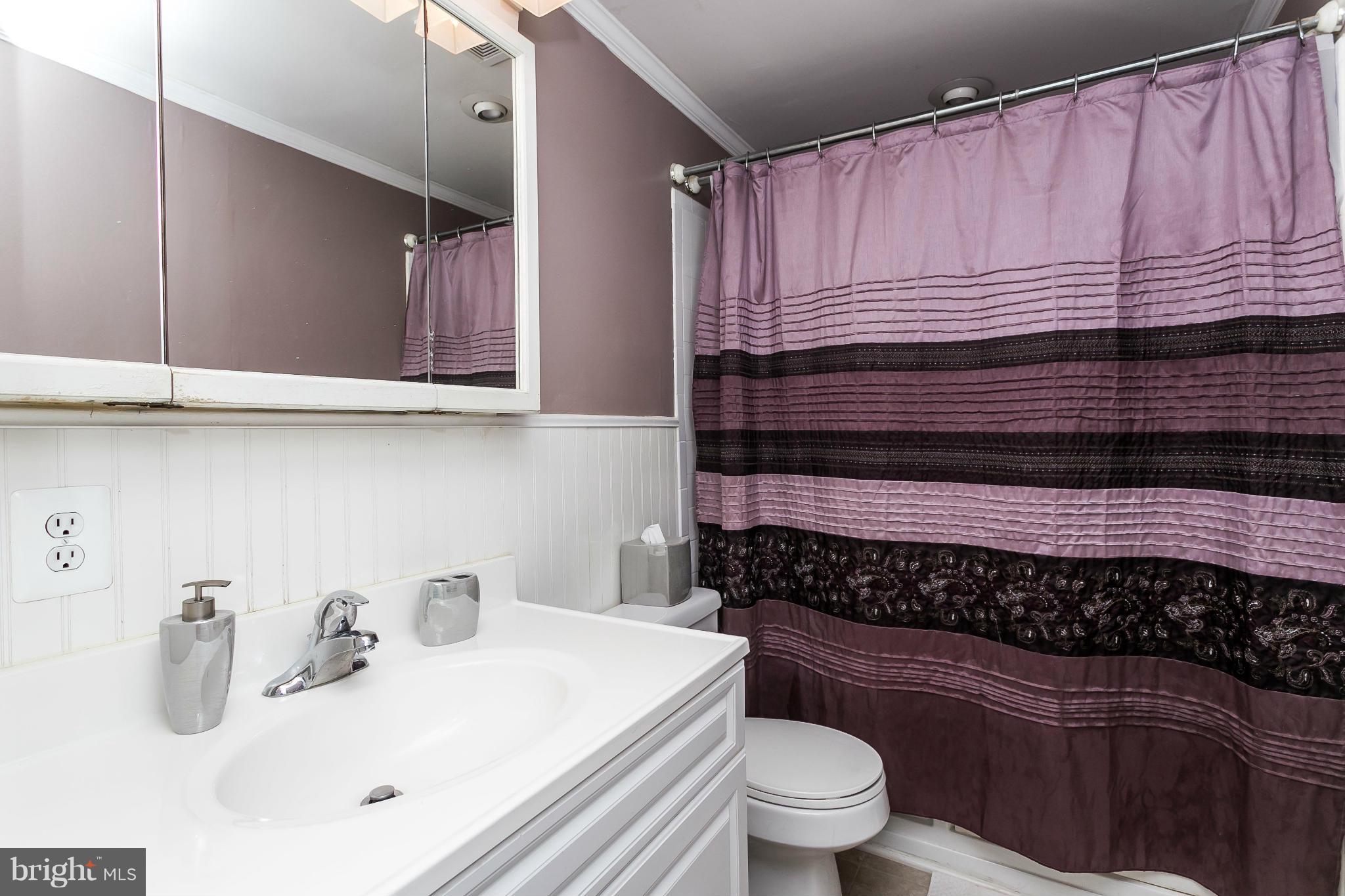 4804 Variation Road Baltimore, MD 21236 - Photo 16 of 27 a bathroom with a sink a toilet and bathtub