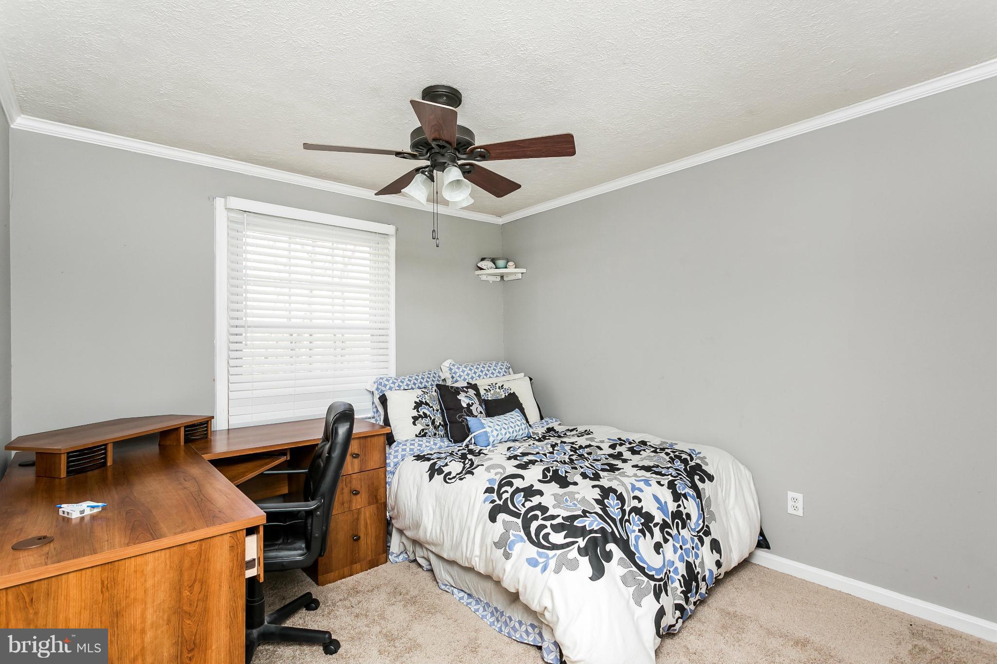 4804 Variation Road Baltimore, MD 21236 - Photo 17 of 27 a bedroom with a bed and a window
