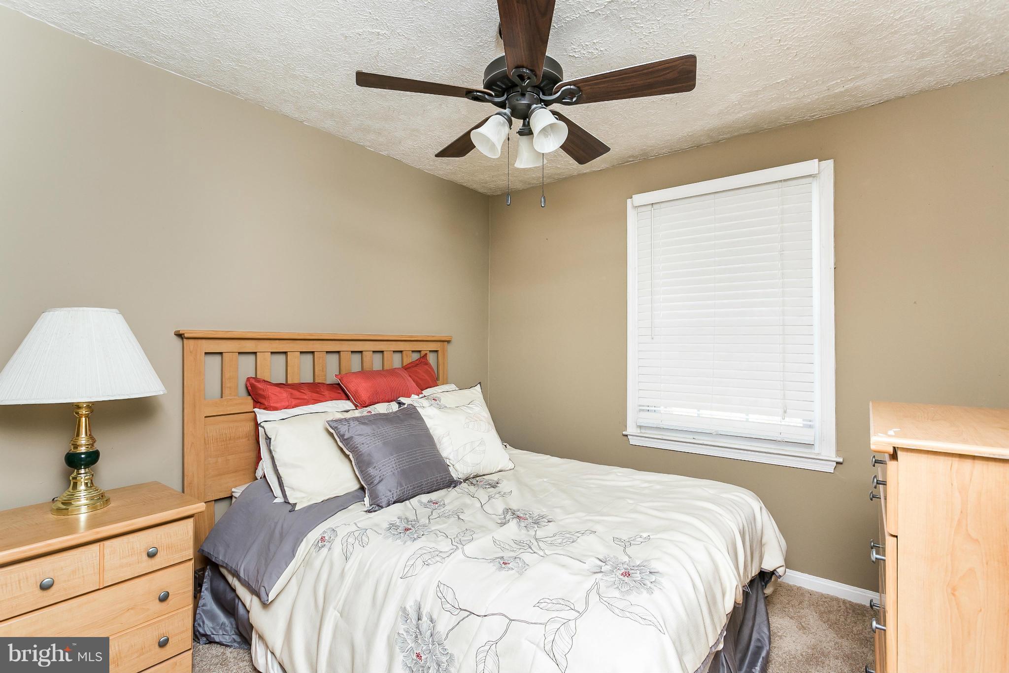 4804 Variation Road Baltimore, MD 21236 - Photo 18 of 27 a bedroom with a bed and a window
