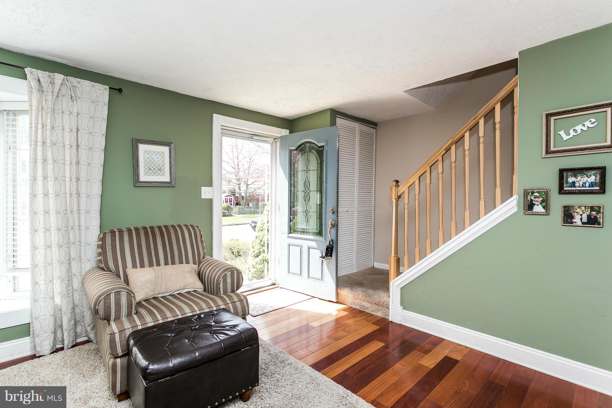 4804 Variation Road Baltimore, MD 21236 - Photo 3 of 27 a living room with furniture and a floor to ceiling window