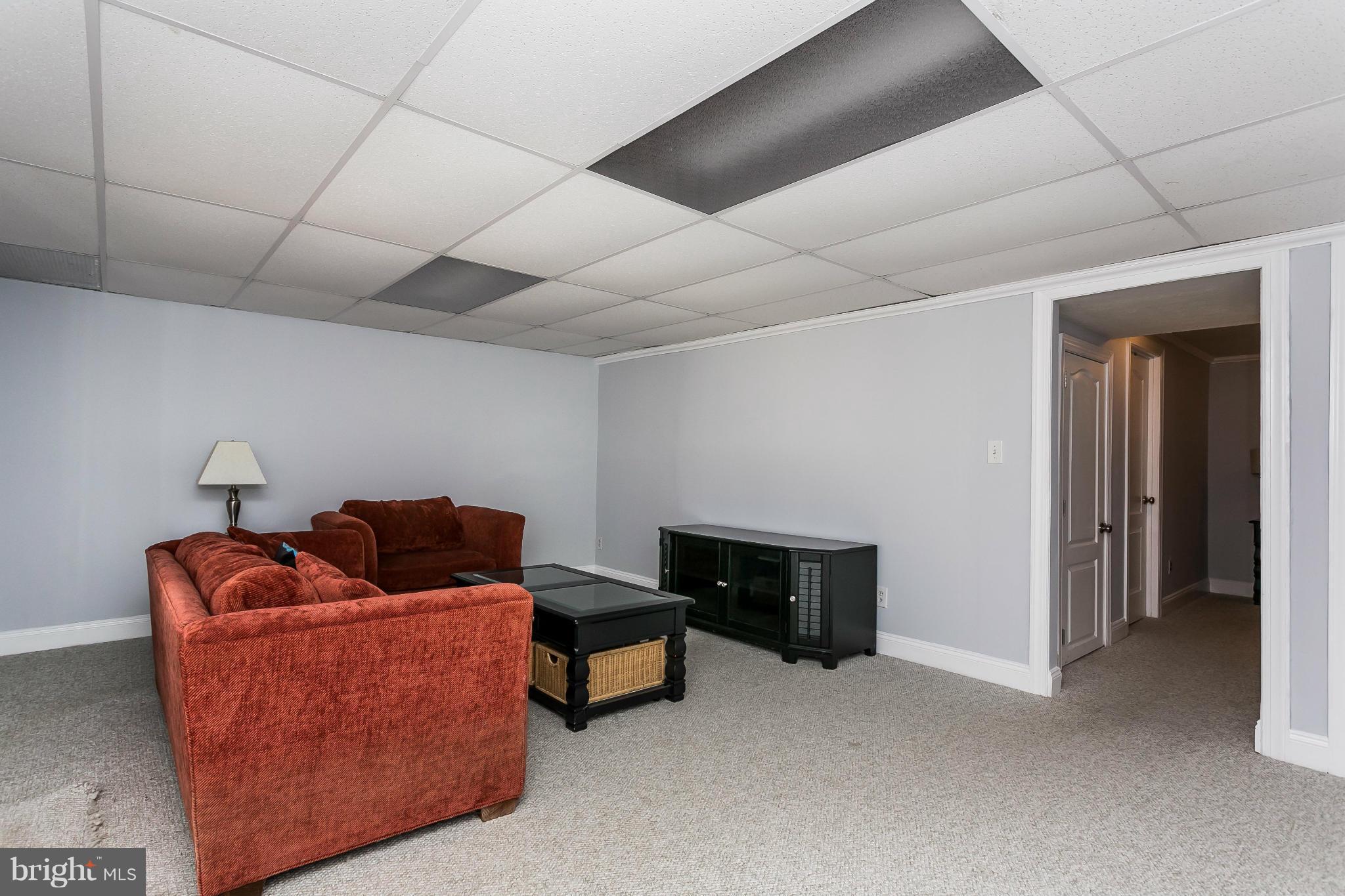 4804 Variation Road Baltimore, MD 21236 - Photo 22 of 27 a living room with furniture and a air conditioner vent