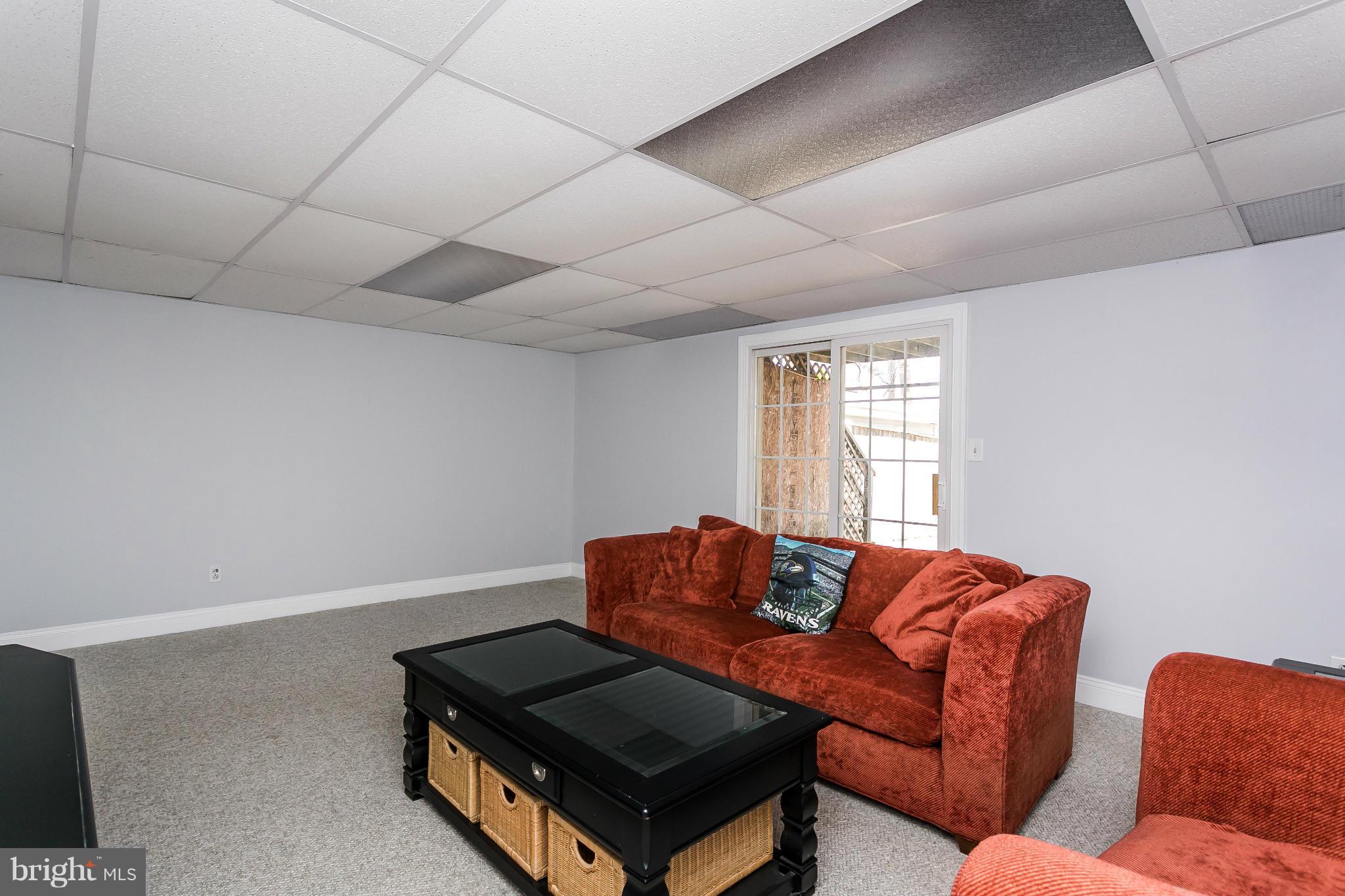 4804 Variation Road Baltimore, MD 21236 - Photo 23 of 27 a living room with furniture and a window