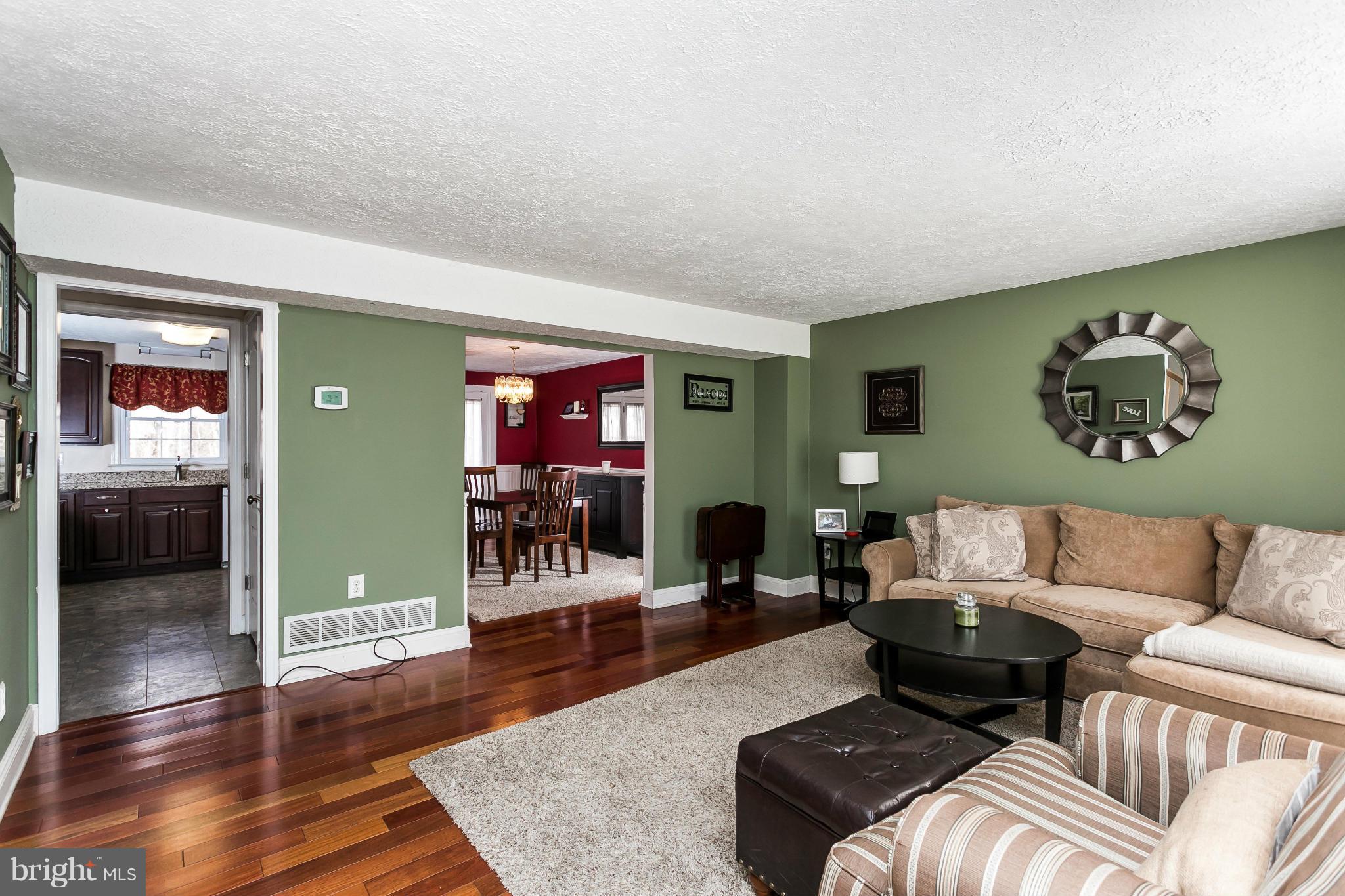 4804 Variation Road Baltimore, MD 21236 - Photo 4 of 27 a living room with furniture and wooden floor