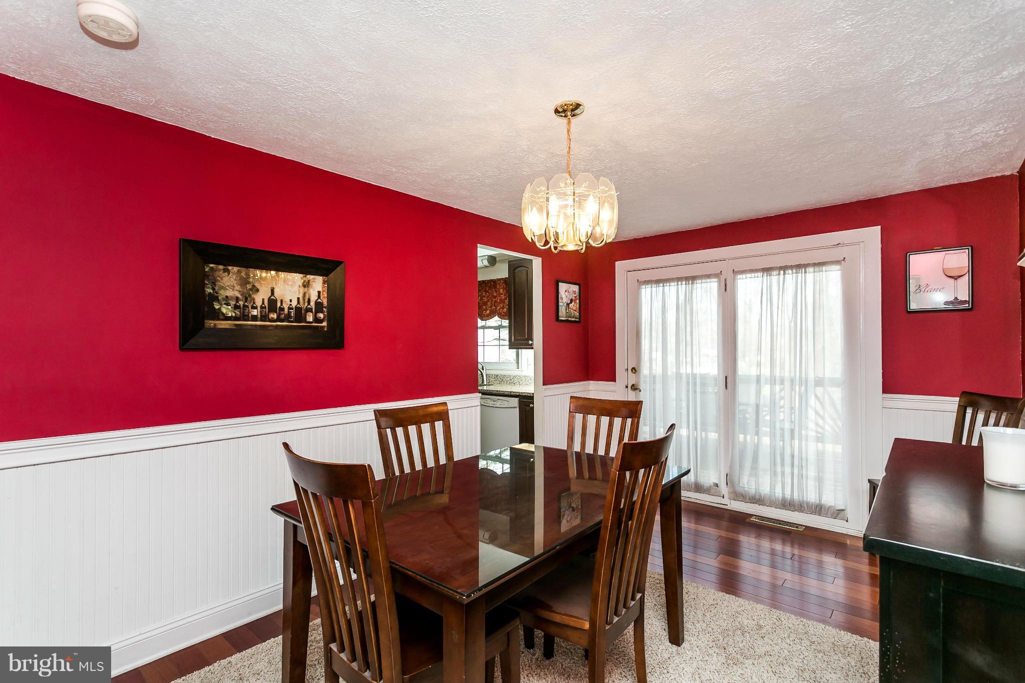 4804 Variation Road Baltimore, MD 21236 - Photo 7 of 27 a view of a dining room with furniture wooden floor and chandelier