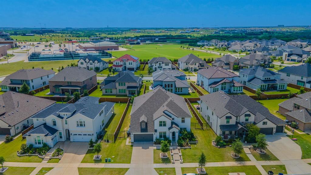 2521 Maidenhair Road Frisco, TX 75033 - Photo 33 of 39 Aerial perspective of a developed residential area with numerous single-family homes, each featuring a private driveway and green lawn space