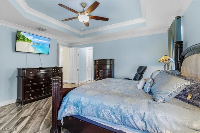 a work room with furniture and a ceiling fan