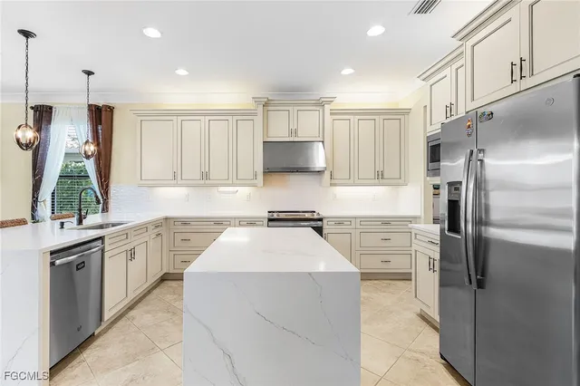a living room with furniture and a large window with wooden floor
