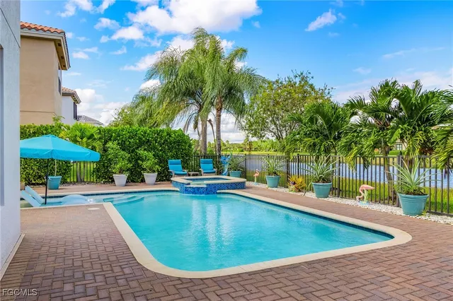 a view of a swimming pool with a lounge chairs