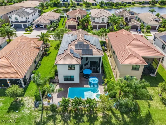 an aerial view of multiple houses with yard