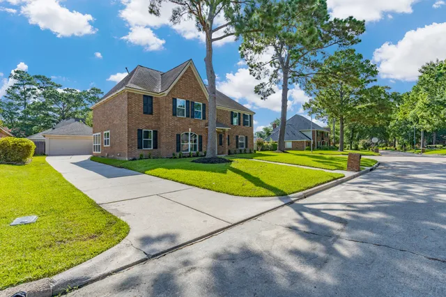 a view of a big house with a swimming pool and a yard