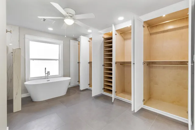 a bathroom with a bathtub and a shower