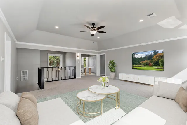 a living room with furniture and a table