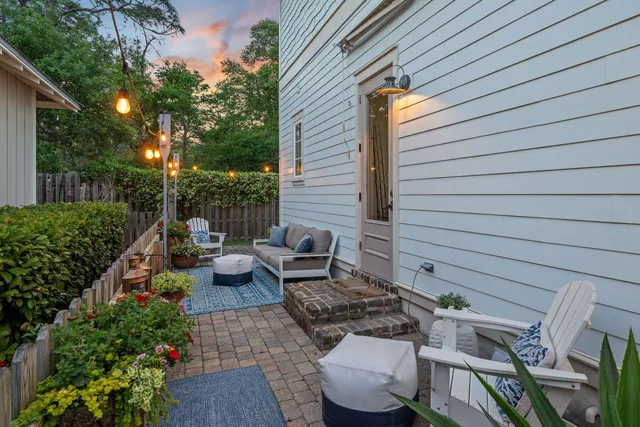 a bathroom with a granite countertop sink a mirror and a shower