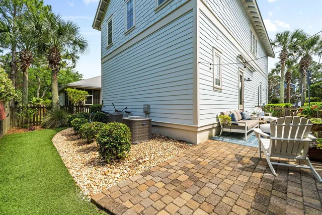 a view of a house with potted plants