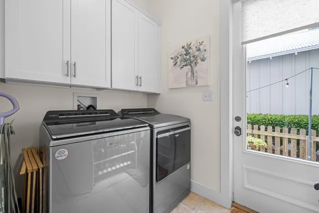 a view of a patio with couches table and chairs and potted plants