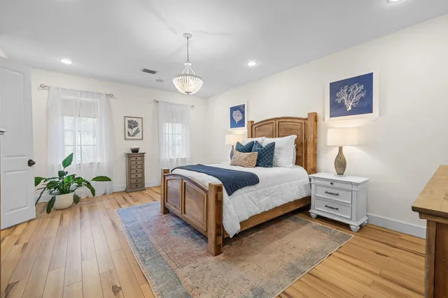 a view of a lake with a table and chairs