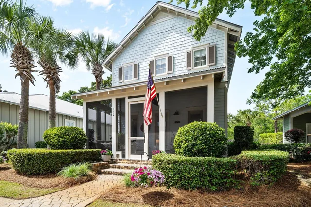 a view of a house with swimming pool and sitting area