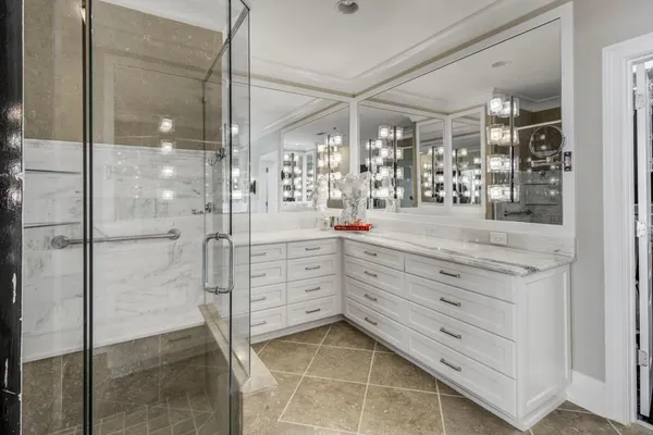 a view of a walk in closet and bathroom