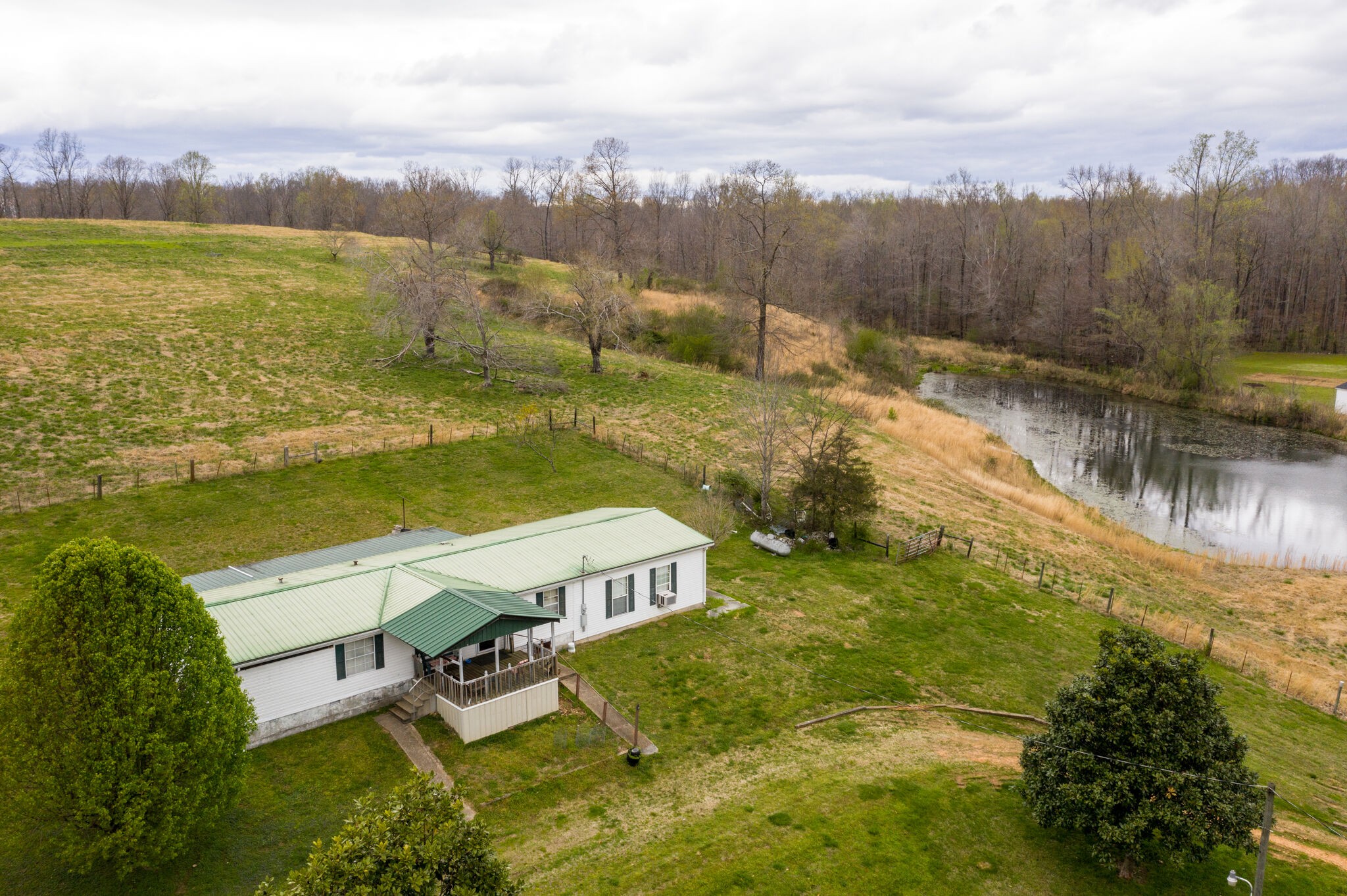 693 Littrell Road Loretto, TN 38469 - Photo 12 of 57 a view of a lake with a mountain