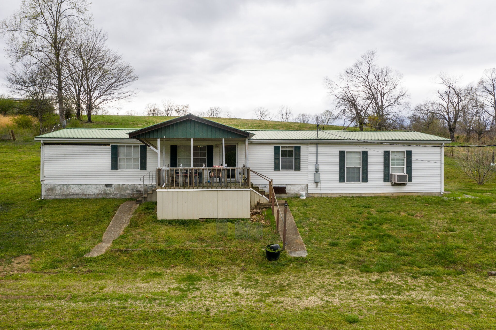693 Littrell Road Loretto, TN 38469 - Photo 13 of 57 a front view of house with yard entertaining space and seating area