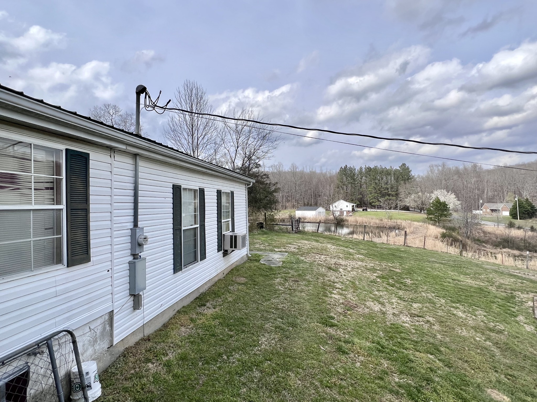693 Littrell Road Loretto, TN 38469 - Photo 14 of 57 a view of a back yard of the house