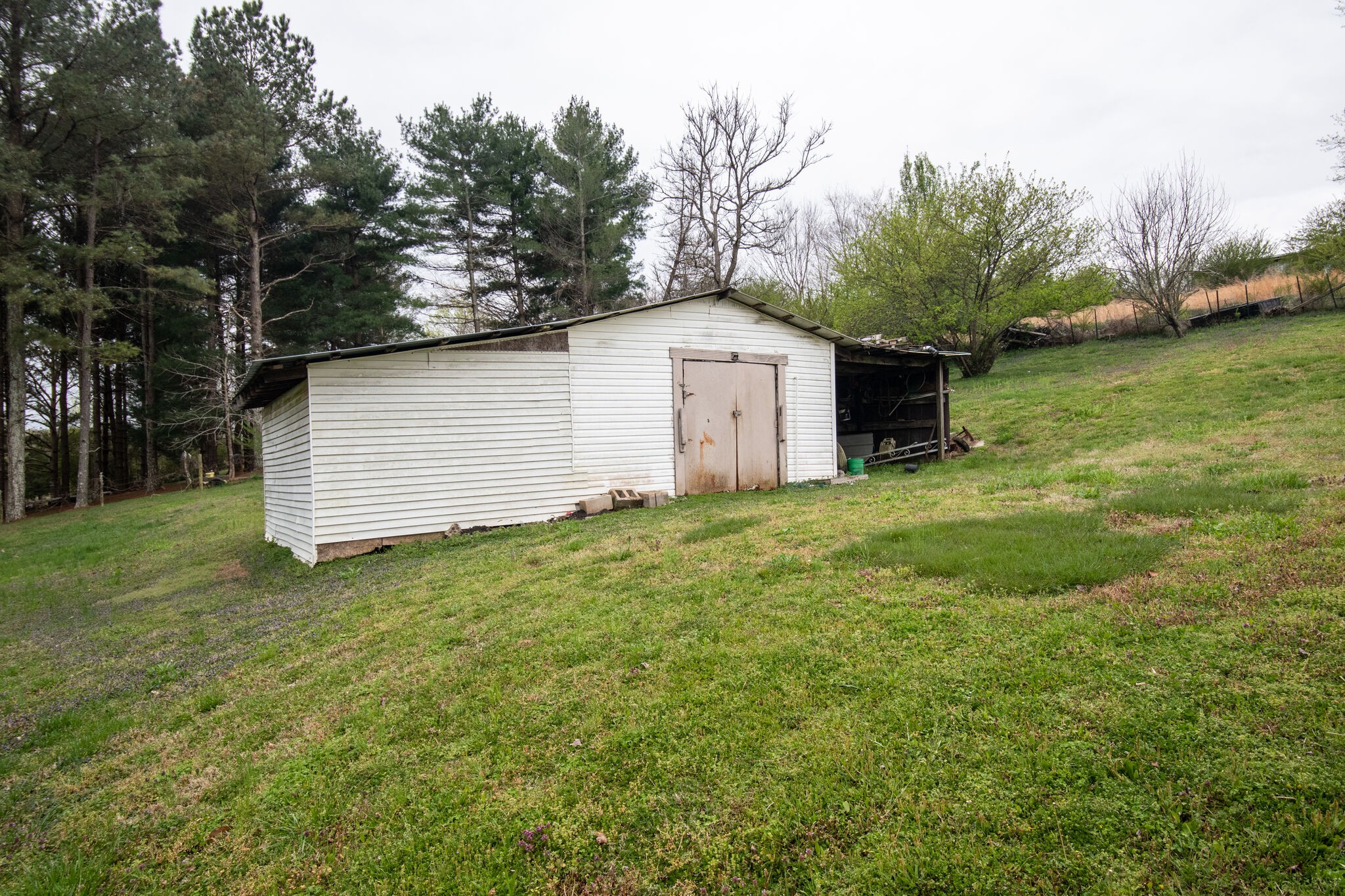 693 Littrell Road Loretto, TN 38469 - Photo 47 of 57 a view of a white house with a yard