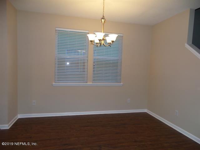 124 Bay Bridge Drive St. Augustine, FL 32080 - Photo 13 of 19 a view of a room with wooden floor and window