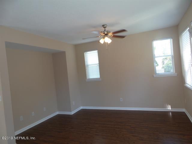 124 Bay Bridge Drive St. Augustine, FL 32080 - Photo 17 of 19 a view of empty room with wooden floor and fan