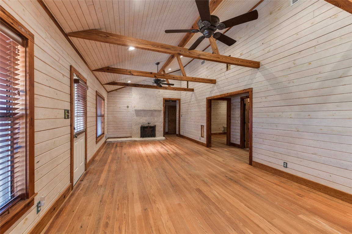 518 Curly H Ranch Road Dripping Springs, TX 78620 - Photo 14 of 40 a view of empty room with wooden floor