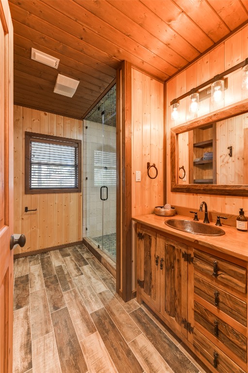 518 Curly H Ranch Road Dripping Springs, TX 78620 - Photo 15 of 40 a view of a bathroom with a sink shower and a mirror