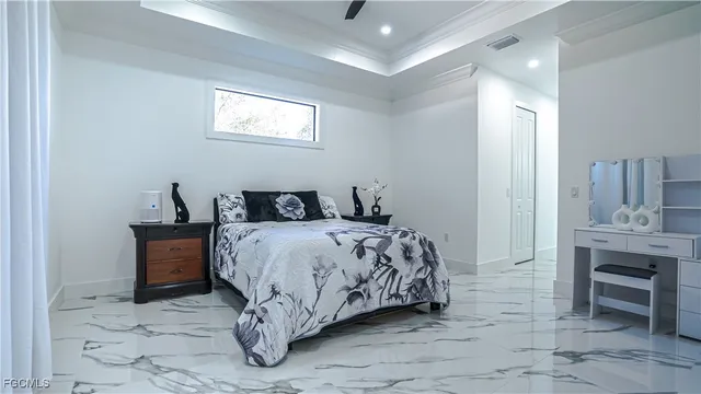a bedroom with a bed and a table