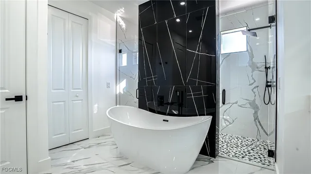 a bathroom with a sink and shower