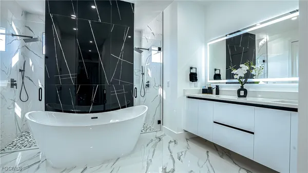 a bathroom with a sink and shower