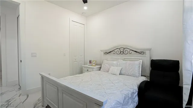 a bedroom with a bed and a closet