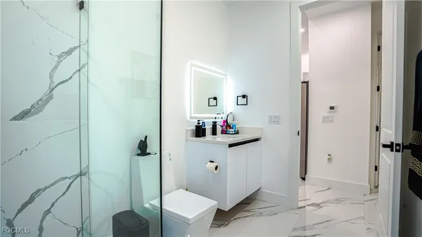 a bedroom with a bed and a closet