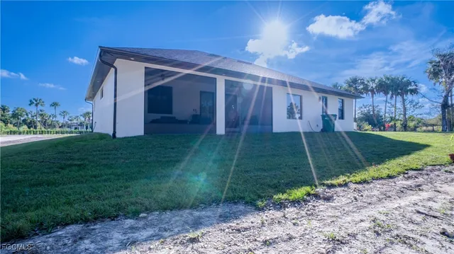 a view of a back yard of the house