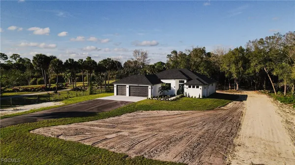 a aerial view of a house with a yard