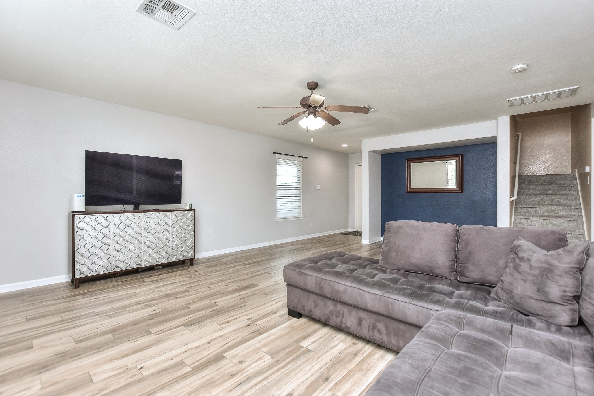 74 Jan Lane Georgetown, TX 78626 - Photo 14 of 31 a living room with a couch and a flat screen tv