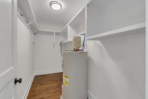 a view of storage and utility room with stairs